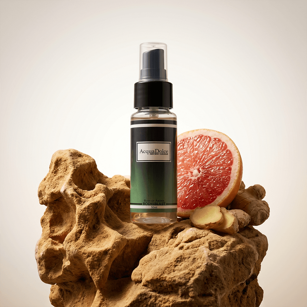 Spray bottle with a label on a textured stone surface with a grapefruit half.