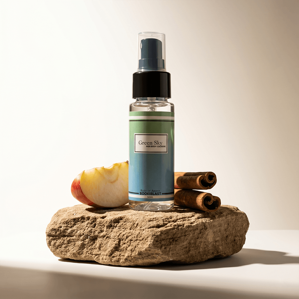 Bottle of 'Green Sky' product on a rock with an apple and cinnamon sticks