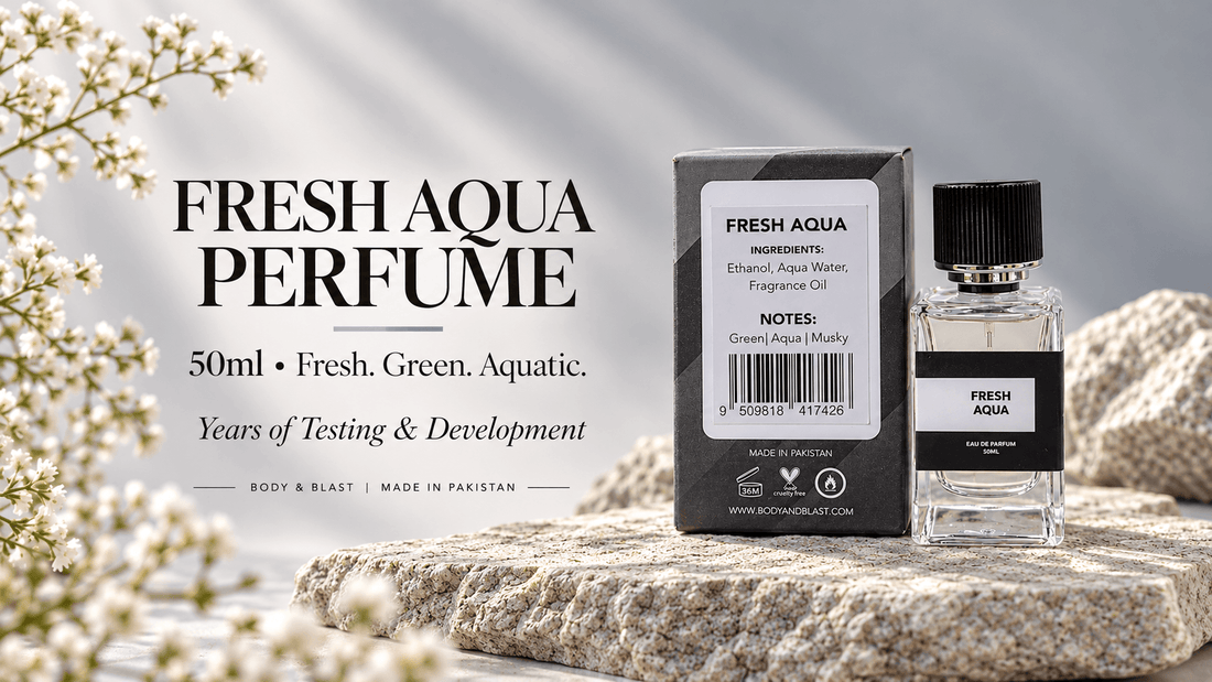 Fresh Aqua Perfume 50ml by Body & Blast Pakistan with matching black and grey packaging on a natural stone display.
